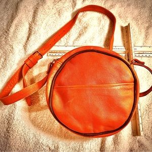 Hand made leather bag. Outside pocket. Adjustable strap. Zipper.